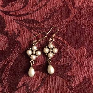 Silver earrings.